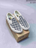 Pair of navy-and-white checkerboard low-top Vans sneakers displayed on a Vans shoe box.
