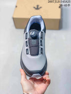Top view of the sneaker showing the gray toe area, black tongue, BOA-marked dial, and lace guides.