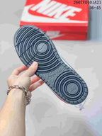 Close view of the dark textured rubber outsole with circular traction grooves.