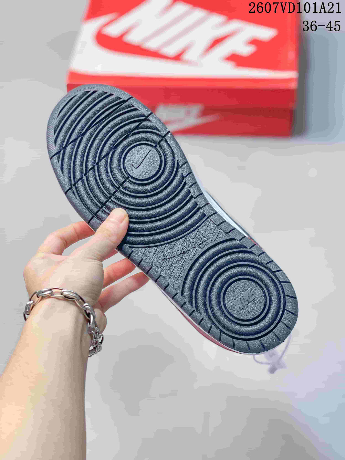 Close view of the dark textured rubber outsole with circular traction grooves.