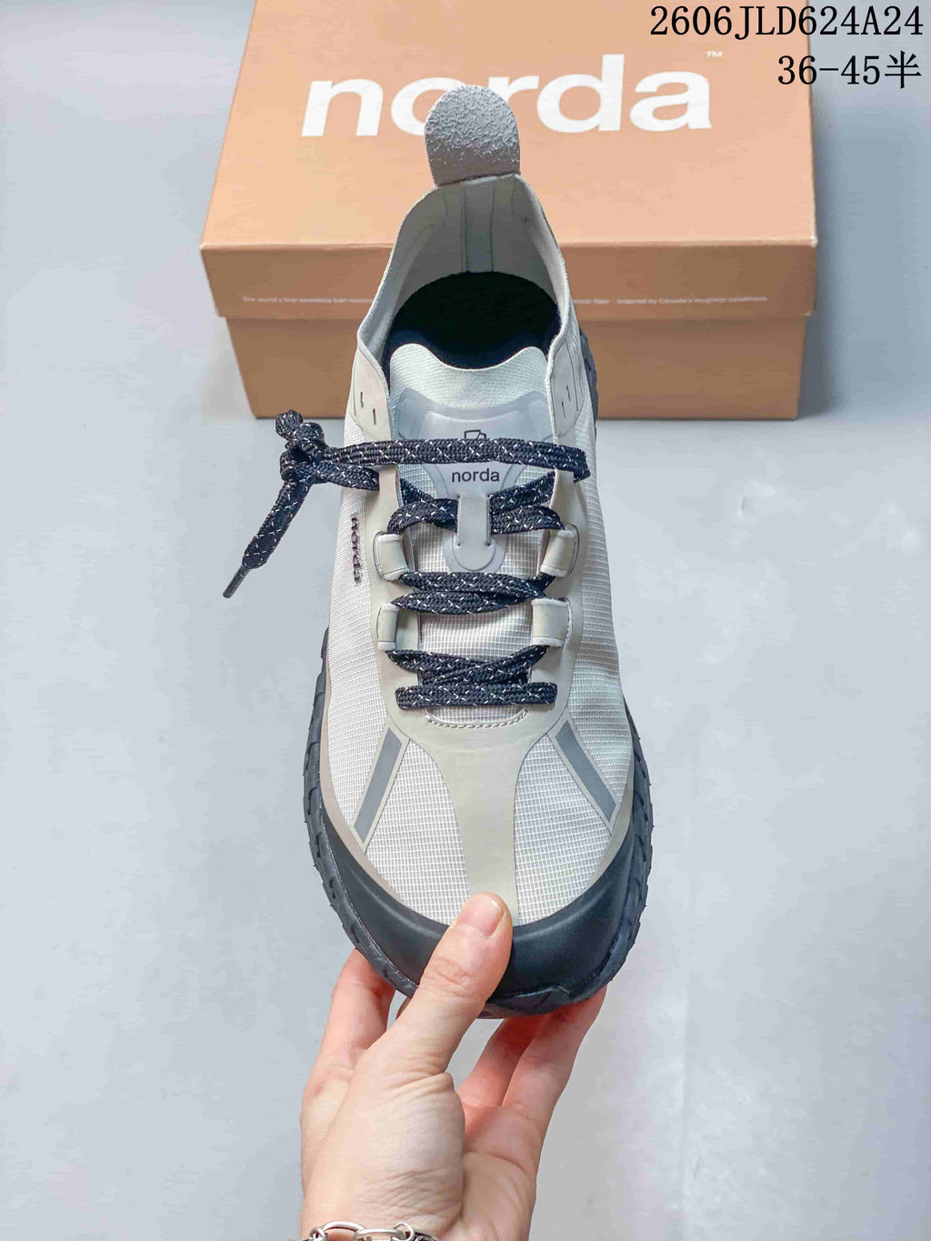 Top view showing the shoe's dark laces, protective toe overlay, and patterned upper.