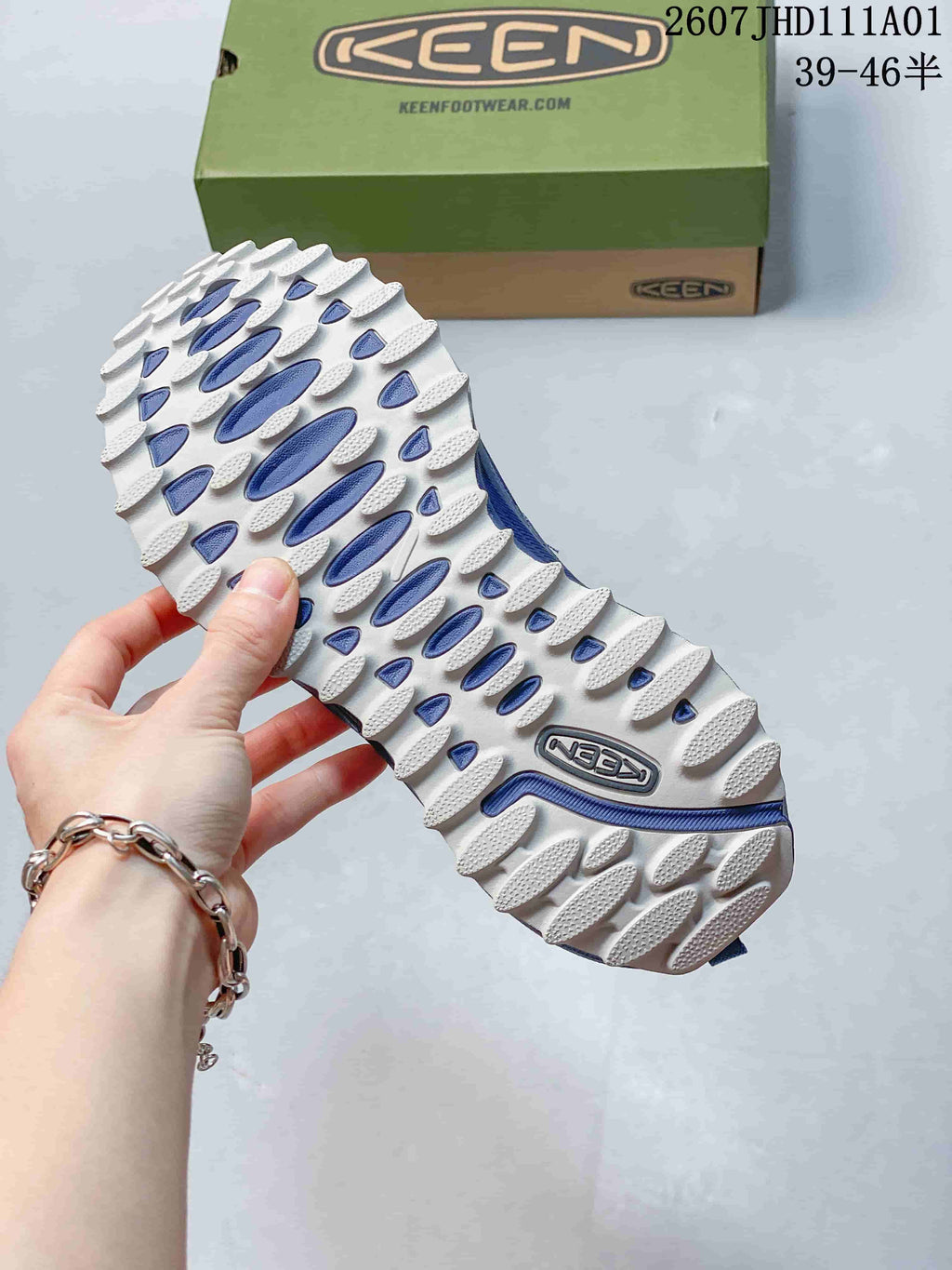 Close-up of the white and blue lugged outsole