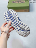Close-up of the white and blue lugged outsole