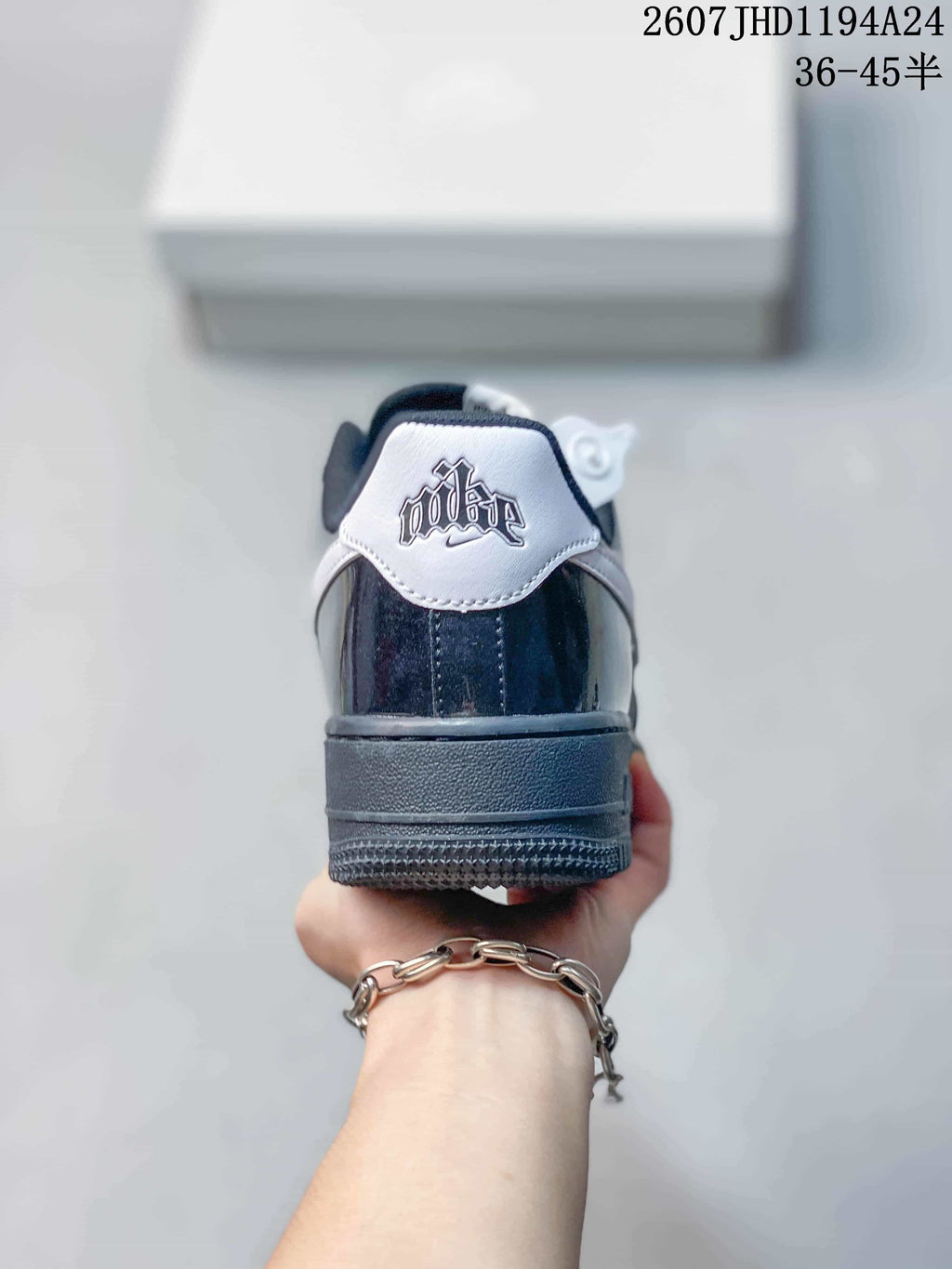 Rear view of the sneaker showing the contrasting heel tab, stitched details and textured outsole.