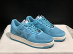 Three-quarter front view of the light blue pair showing the star side panels, lace details, and off-white midsoles.