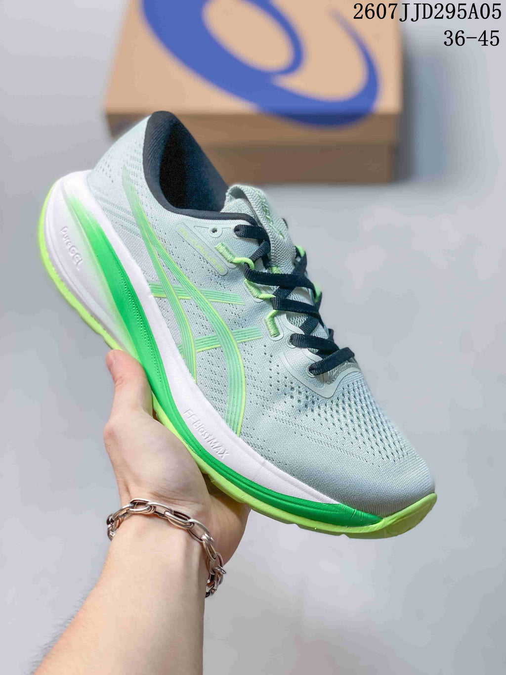 Light gray ASICS running shoe with bright green accents and a green outsole.