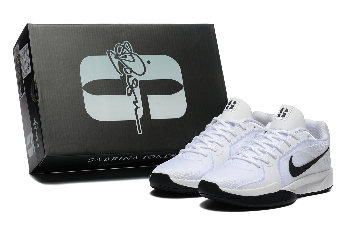 White and black basketball shoes beside a black Sabrina Jones shoe box