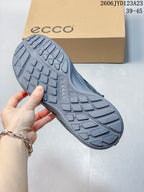 Close-up of the gray sneaker's patterned outsole.