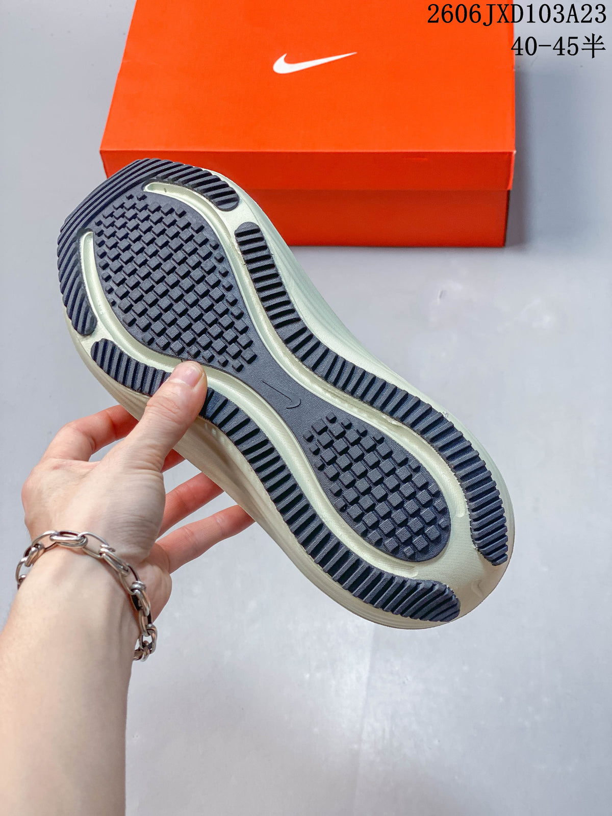 Close-up of the running shoe outsole with patterned dark tread