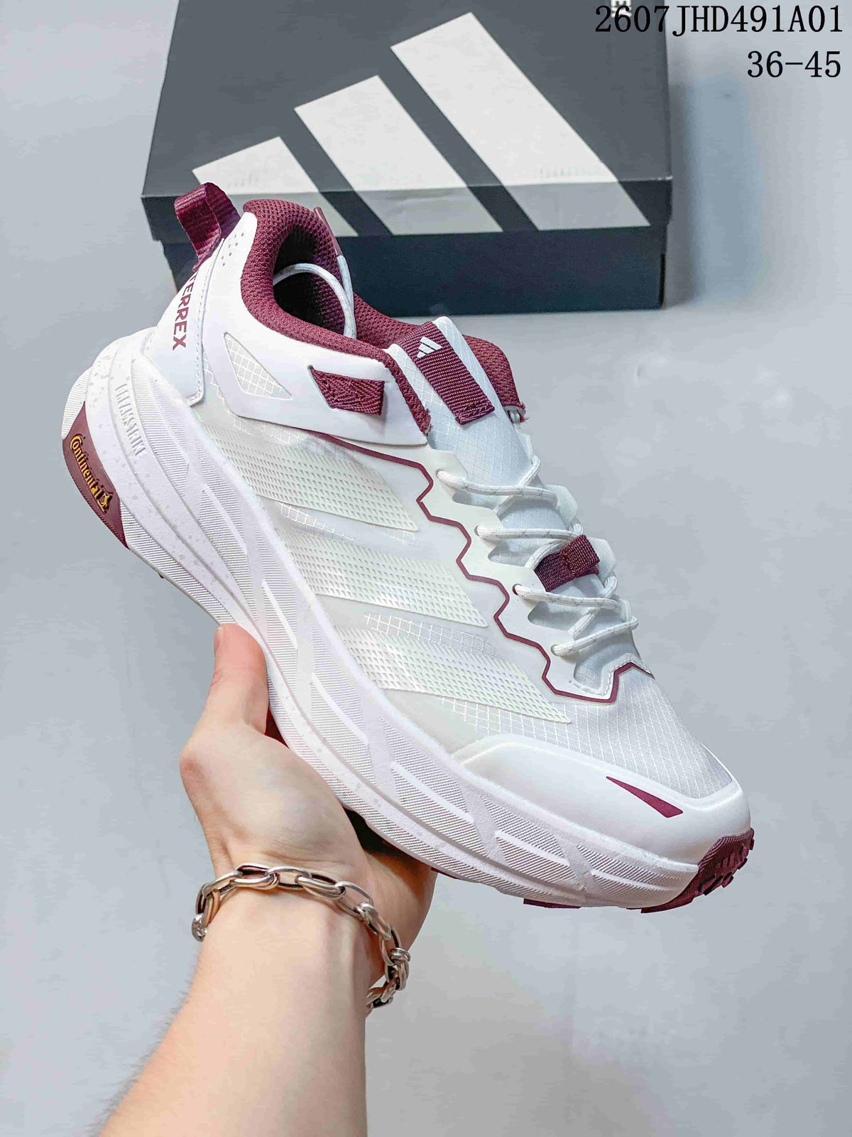White Adidas Terrex low-top shoe with burgundy accents and a sculpted sole; image also displays the size range 36–45.