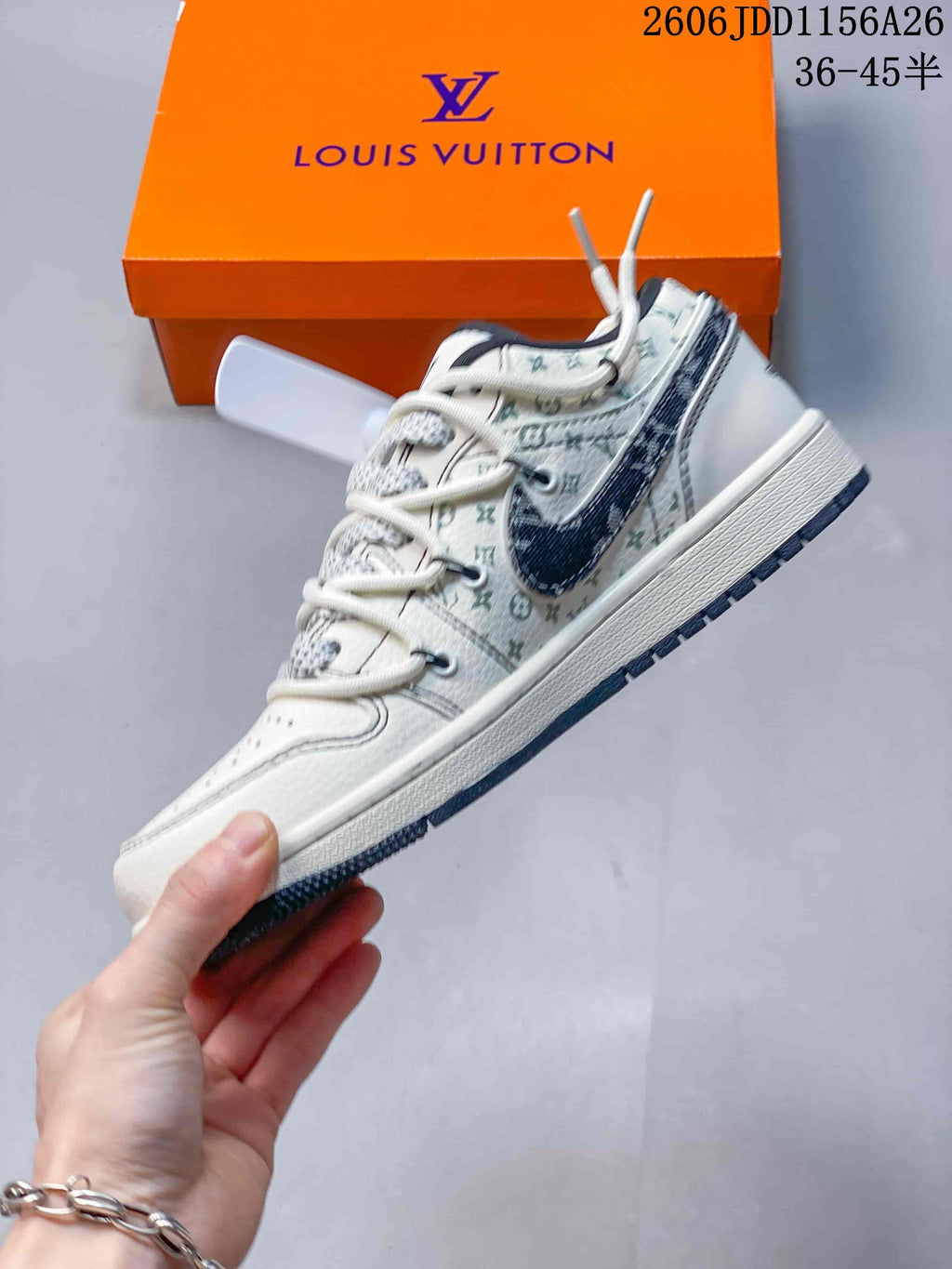 Side profile showing the white low-top construction, dark overlay, patterned upper, and layered sole.