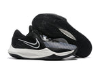 Black and white basketball shoe with a white side accent and black patterned outsole.