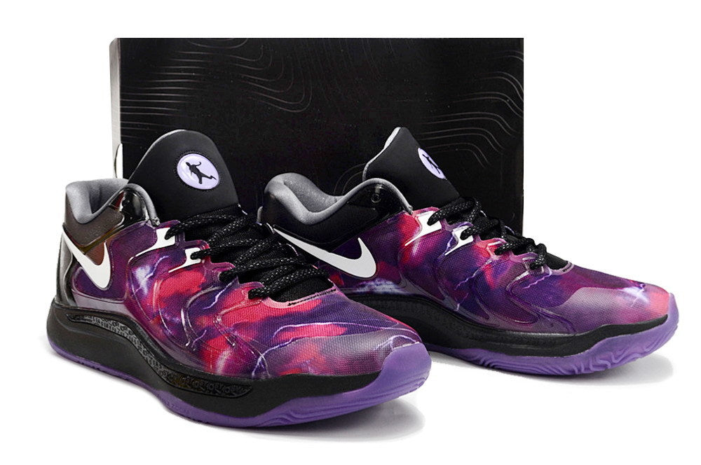 Pair of Nike KD 17 shoes in a purple, red, black and white color combination.