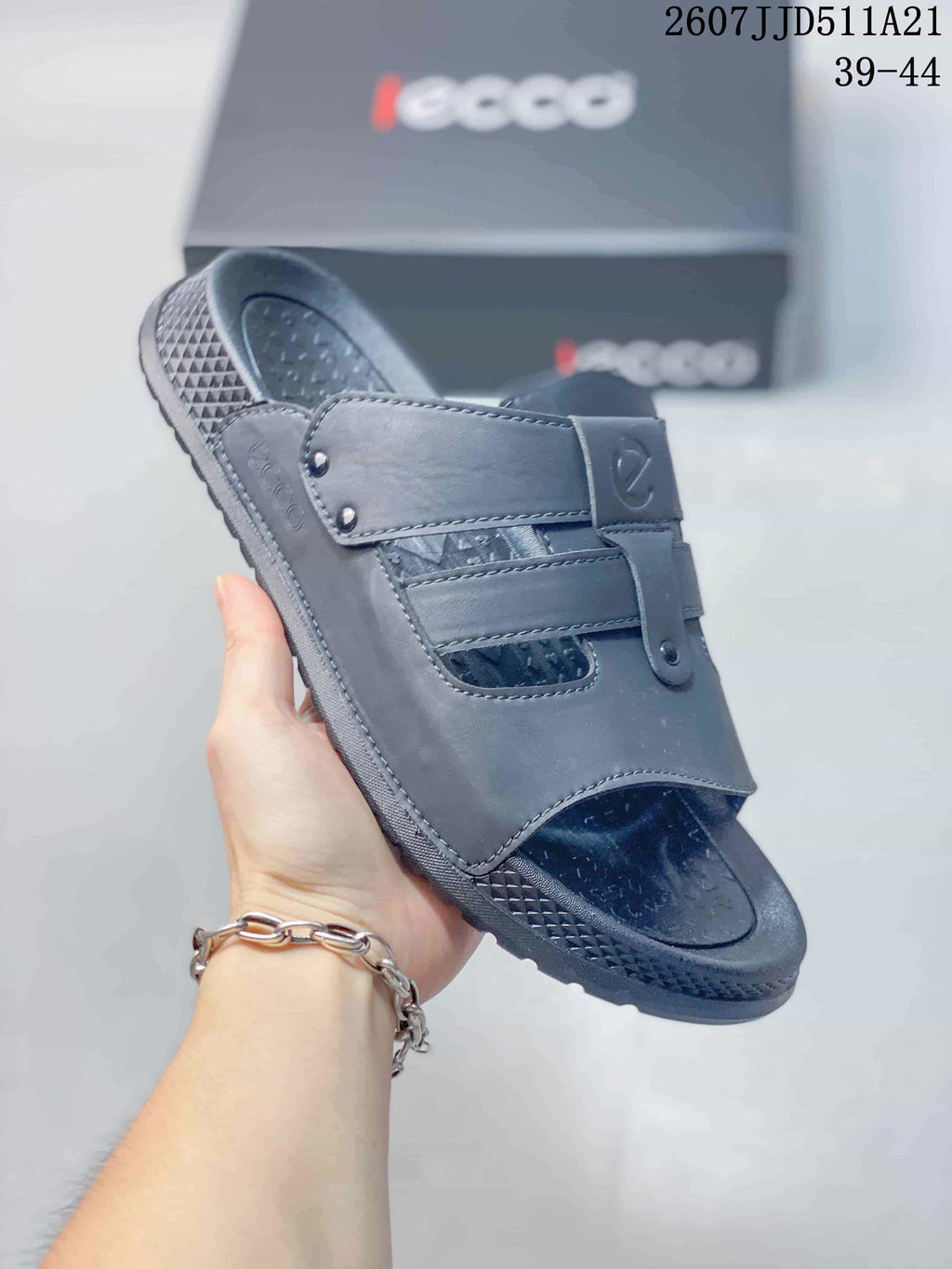 Angled close view of a gray ECCO sandal showing the open toe, strap details, and textured outsole.