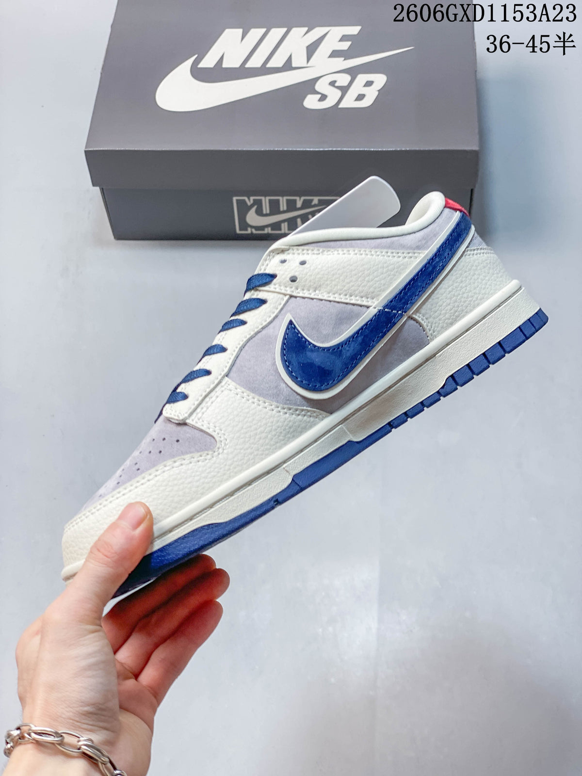 Side profile of the low-top sneaker with blue Swoosh and layered panels