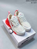 Pair of white and red Nike Air Max 270 Premium sneakers on a shoebox