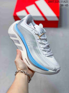 Angled side view showing the Adidas branding, Hyperboost lettering, gray upper panels, and blue midsole accent.