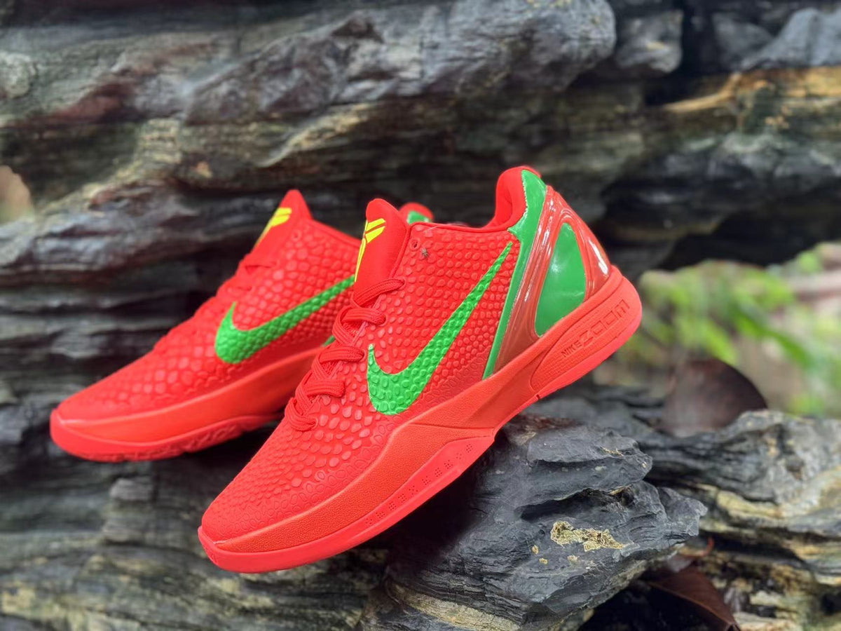 Angled view of the red textured upper and green swoosh on Nike Kobe 6 shoes