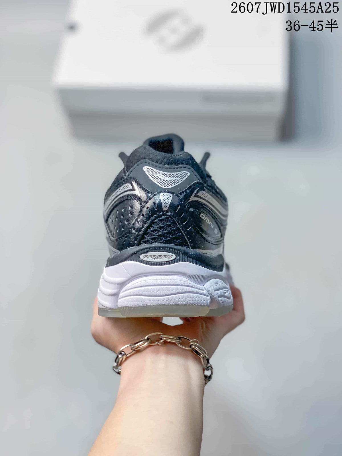 Rear view of the Saucony ProGrid Omni 9 sneaker showing the padded heel, layered details and sculpted white sole.