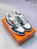 Pair of navy, white and red low-top sneakers with patterned side panels, white laces and an orange shoebox.