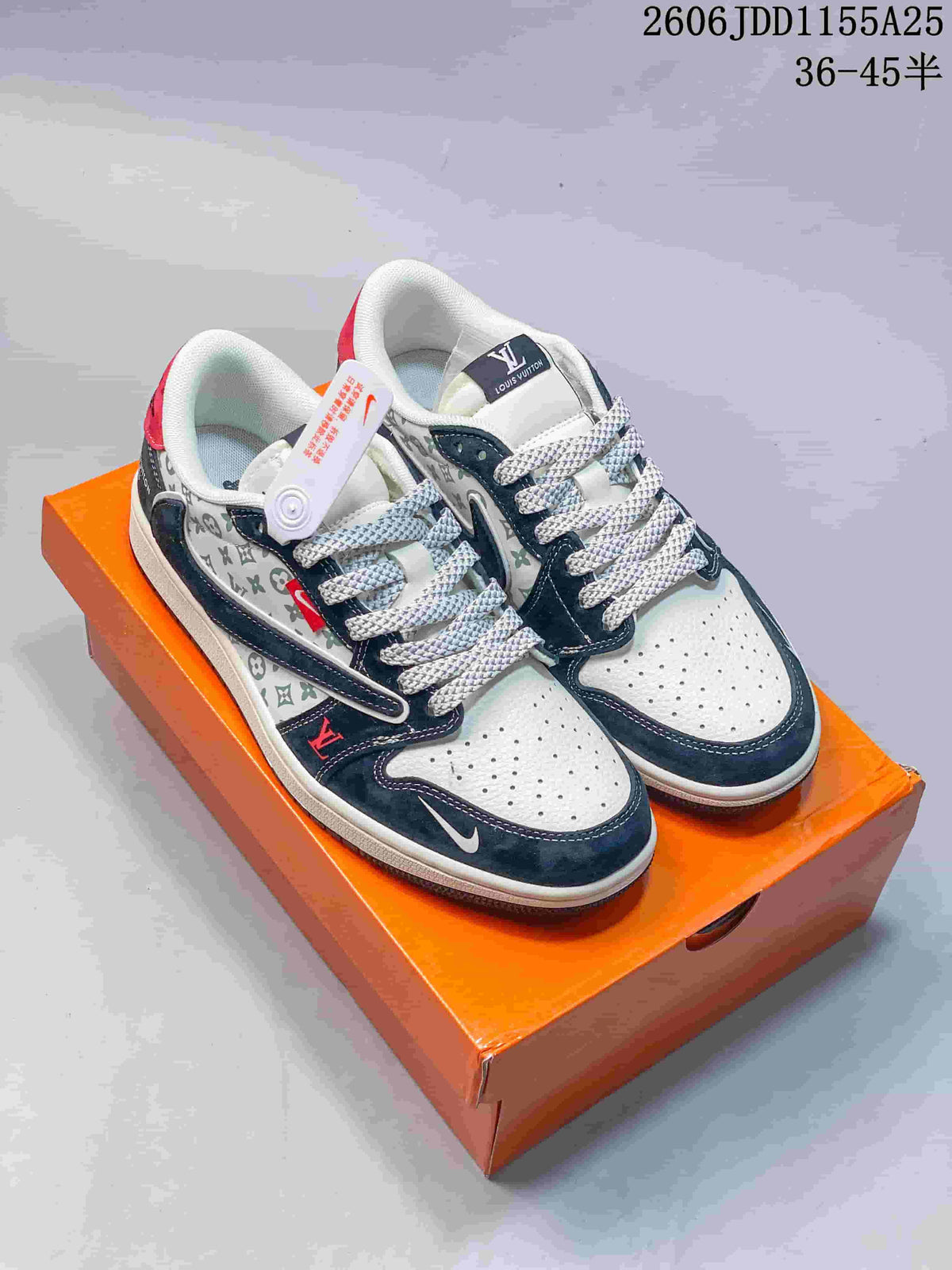 Pair of navy, white and red low-top sneakers with patterned side panels, white laces and an orange shoebox.
