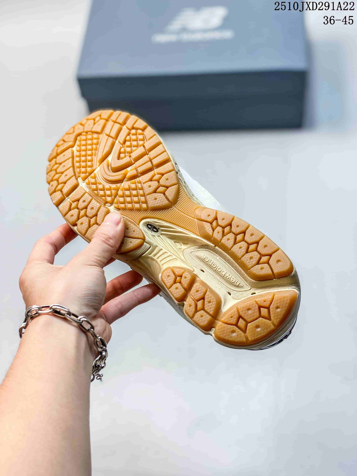 Gum-colored outsole with a patterned tread on a New Balance 1906AD sneaker; image also shows the printed size range 36–45.