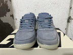 Front view of blue-gray Nike Book 1 shoes with laces and perforated toe panels