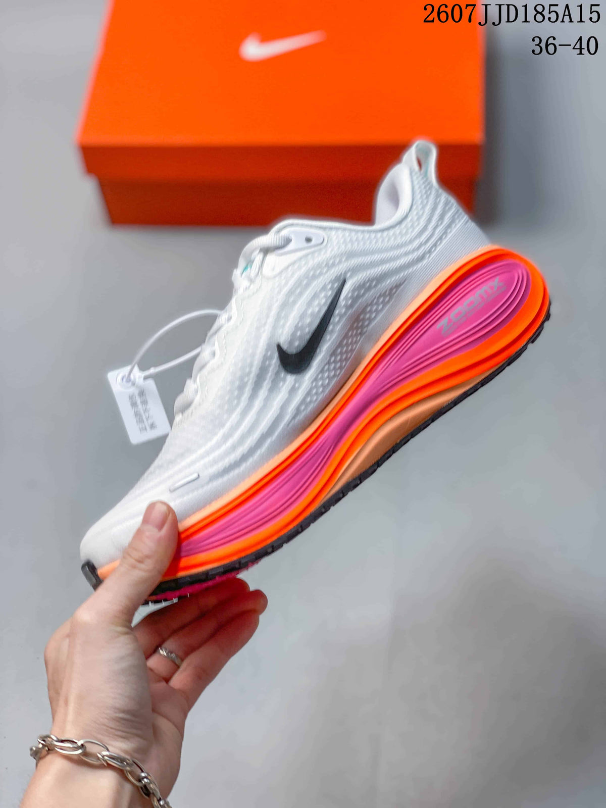 Side view showing the white textured upper, black Nike branding, and colorful layered midsole.