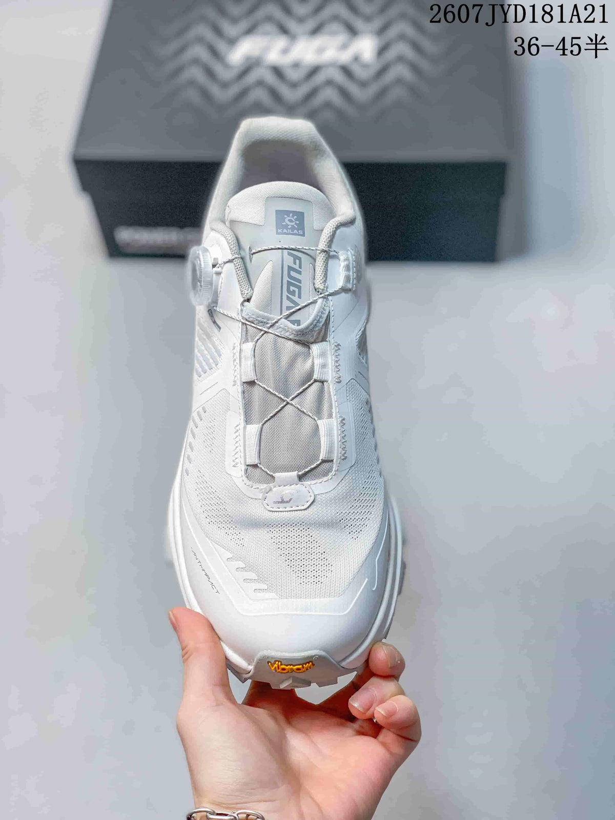 Top view of the white shoe showing the mesh-style upper, tongue branding, and central lace structure.