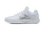 Side profile of a white Nike basketball shoe with a silver-tone Swoosh.