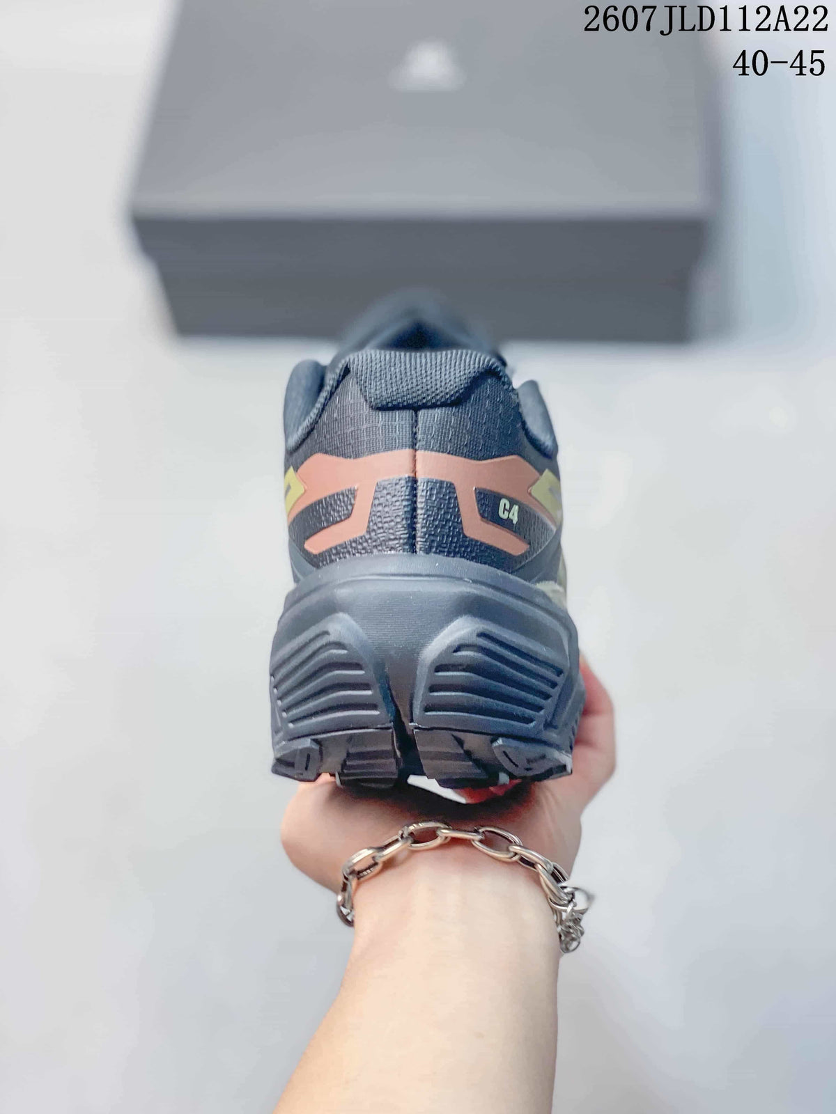 Rear view of the shoe showing the padded heel, C4 marking, and structured lugged outsole.