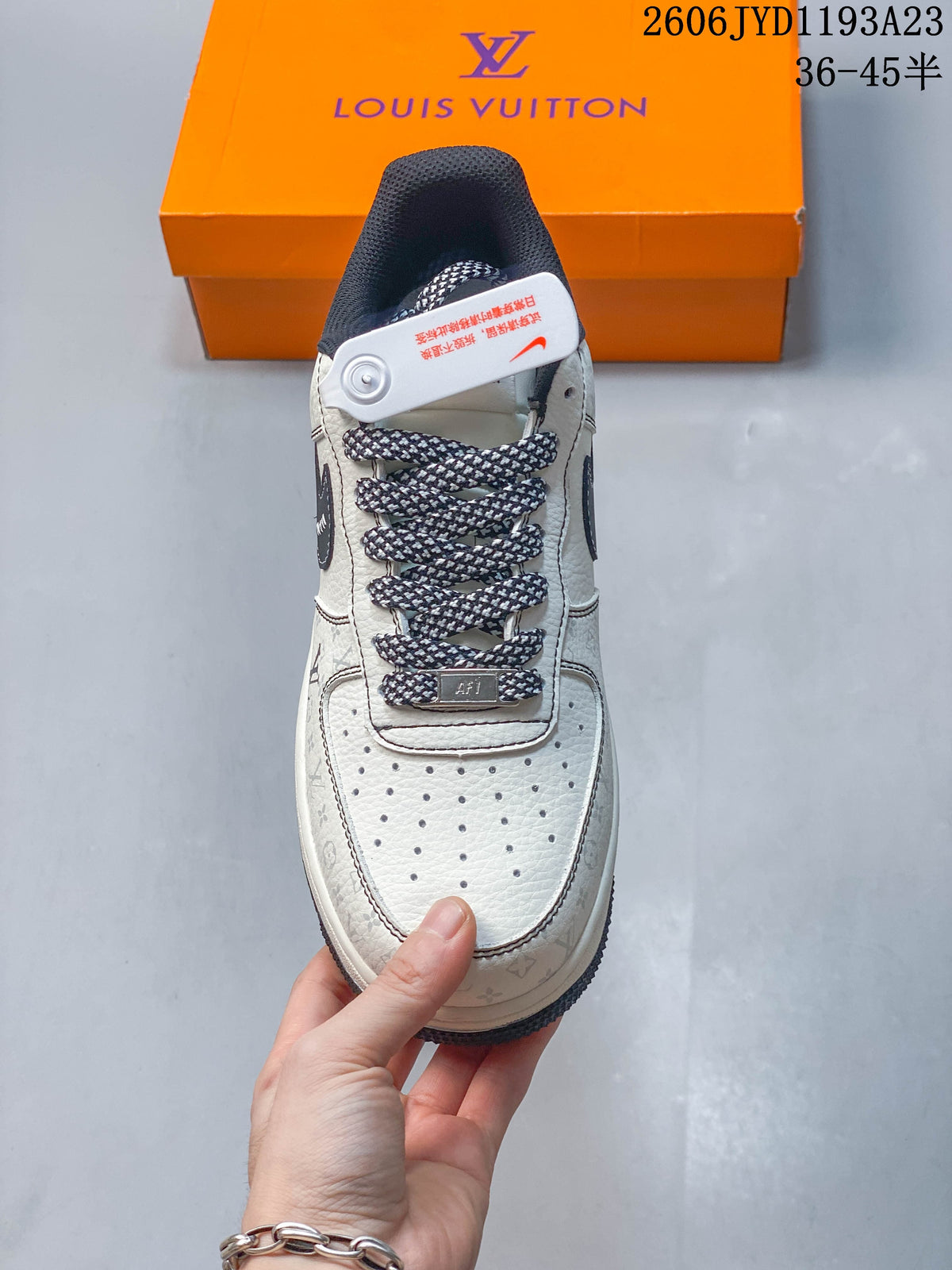 Top view of a sneaker showing patterned laces and a perforated toe