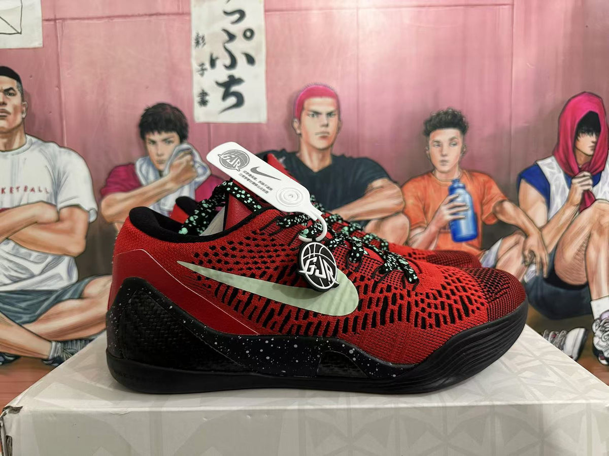 Side view of a red and black low-top shoe with a light-colored Swoosh and speckled heel.