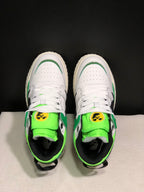 Top view showing white perforated toe boxes, white laces, neon green tongues, and black inner lining.