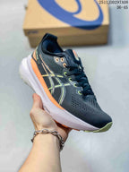 Close side view of the black running shoe showing green and orange accents, a white midsole and visible FF BLAST+ marking.