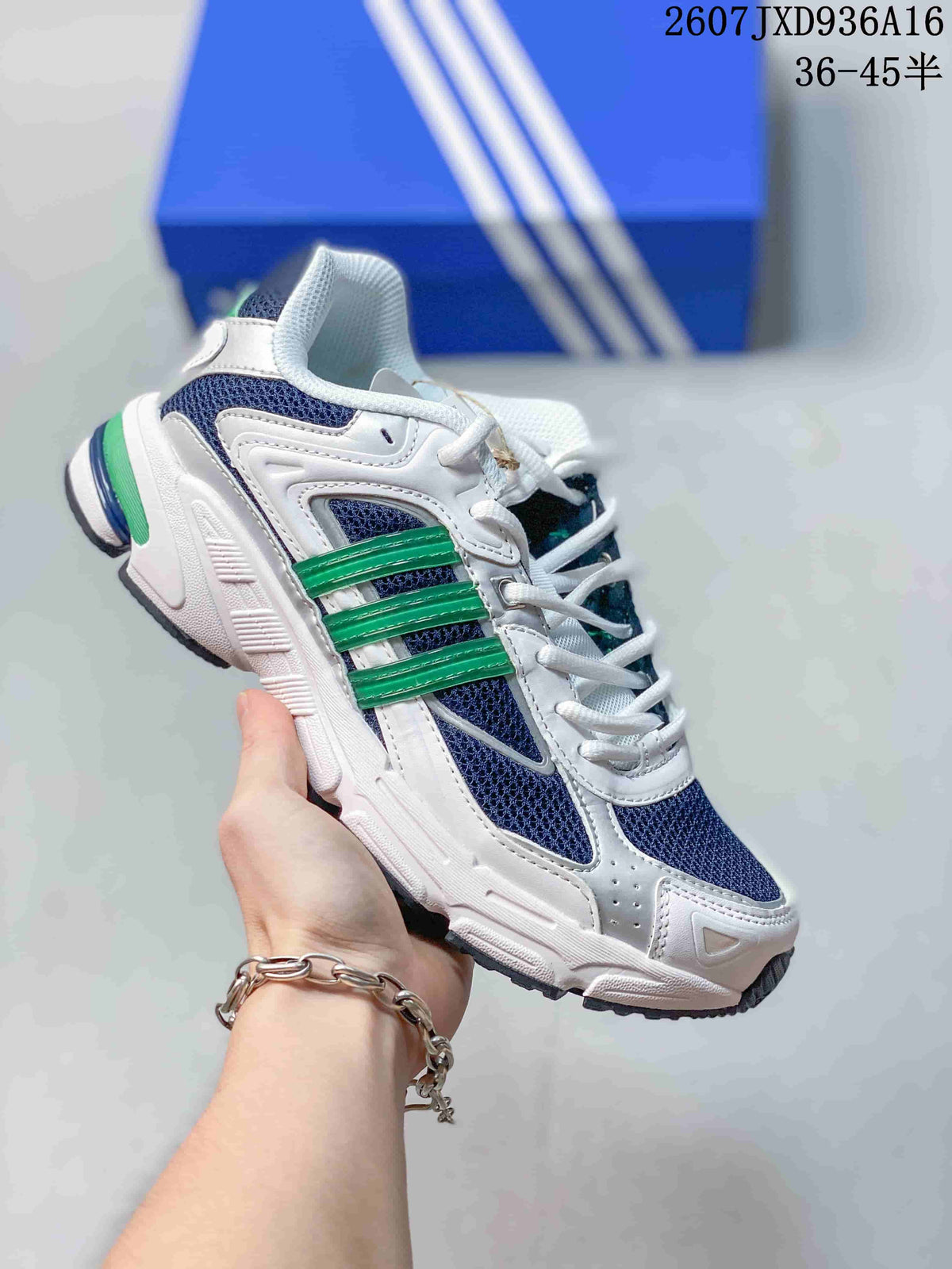 White and navy adidas Response CL sneaker with bright green side stripes, shown against a blue shoe box.