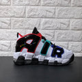 Side view of a white and black high-top sneaker with oversized AIR lettering and red, aqua, and blue accents