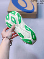 Bottom view of the sneaker showing a white outsole with multiple segmented green traction sections; image text shows 2607JHD114A24 and 36–45 half sizes.