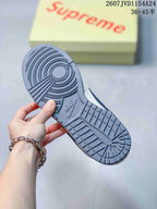 Close-up of the gray rubber outsole showing circular and rectangular traction sections with Nike branding.