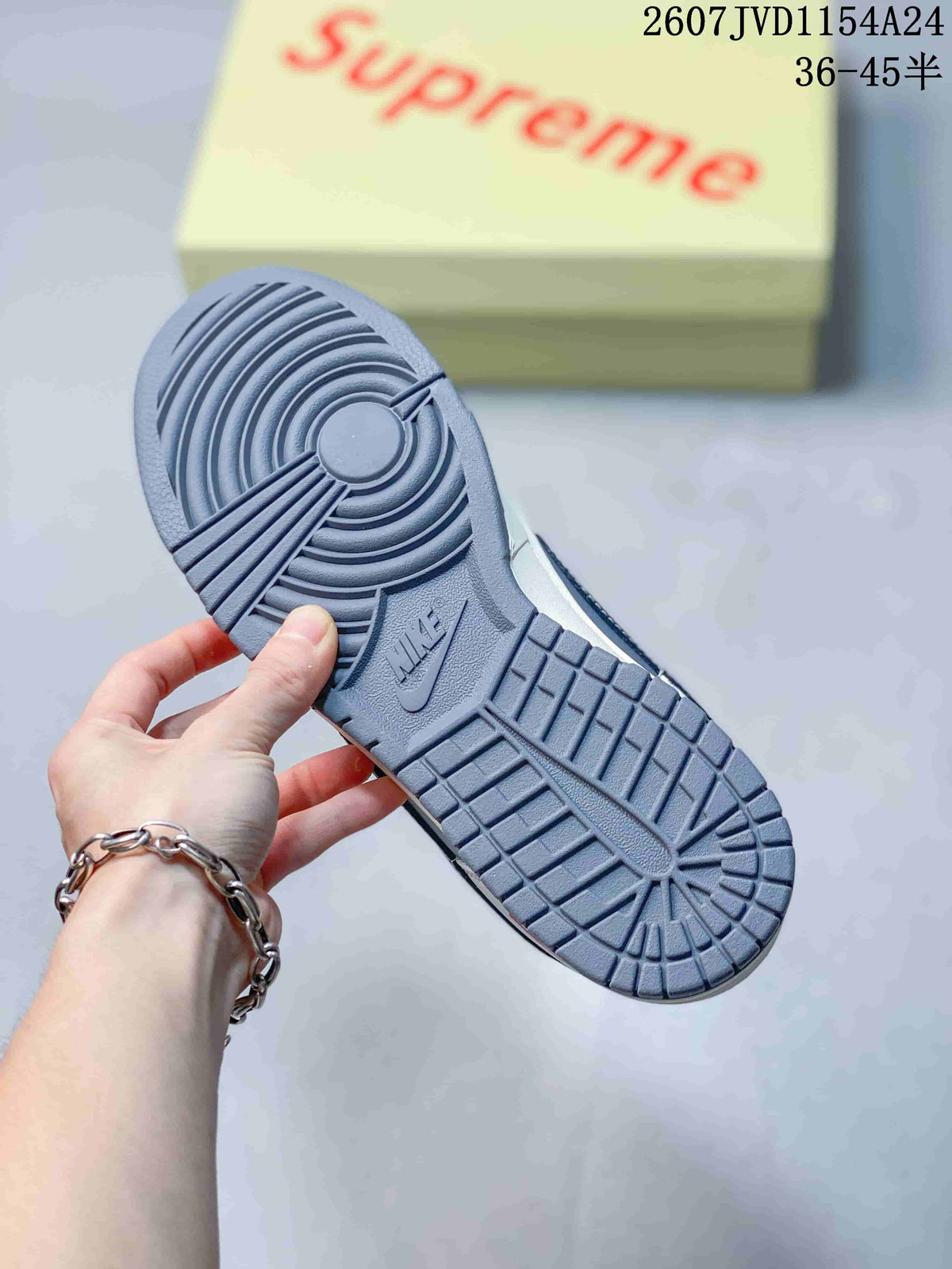 Close-up of the gray rubber outsole showing circular and rectangular traction sections with Nike branding.