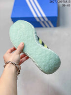 Close-up of the pale textured outsole showing its repeating molded pattern.