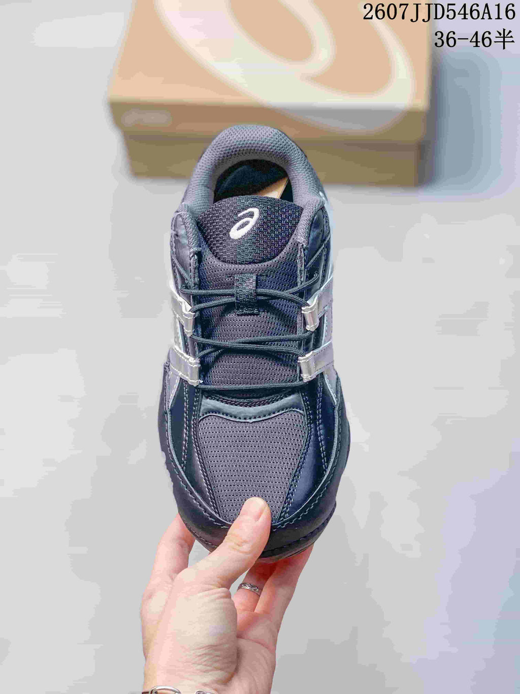 Top view of the ASICS Hypersync sneaker showing the mesh-like toe and tongue panels, laces, and branding.