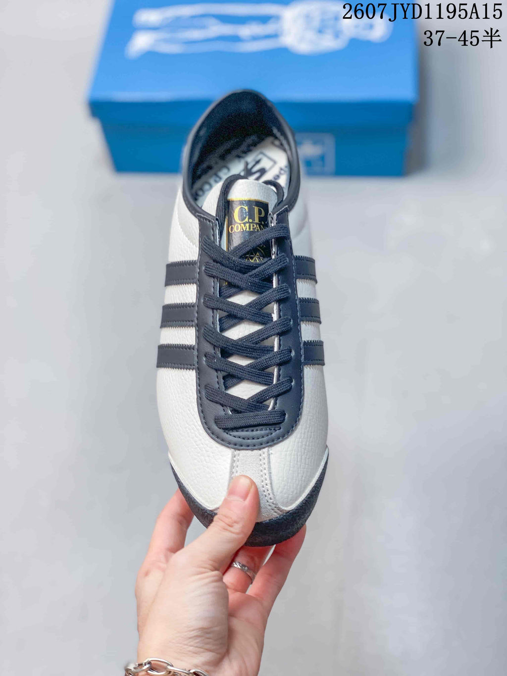 Top view showing the lace-up design, navy overlays, and branded tongue.