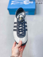 Top view showing the lace-up design, navy overlays, and branded tongue.