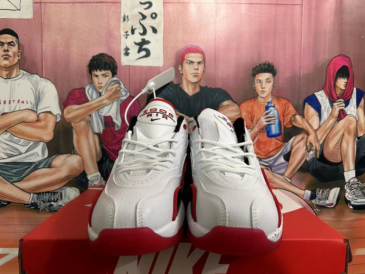 Front view showing white laces and red accents on Nike basketball shoes