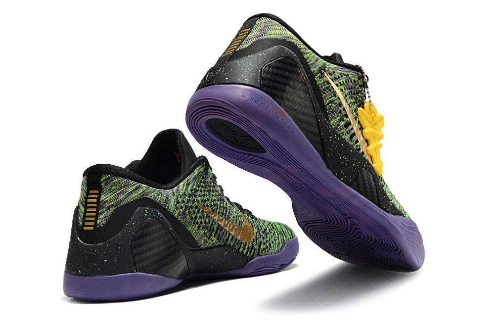 Black, green, and purple shoes shown from the heel and outsole.