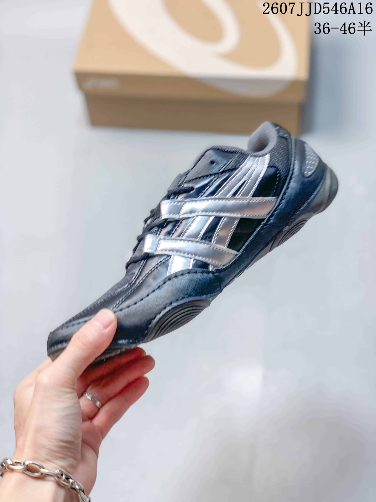 Side view of the dark navy and silver ASICS Hypersync sneaker showing layered side detailing and a low-profile sole.