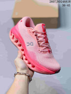 Three-quarter side view of the pink On Cloudtilt sneaker showing the lace-up upper, side logo, and sculpted sole.