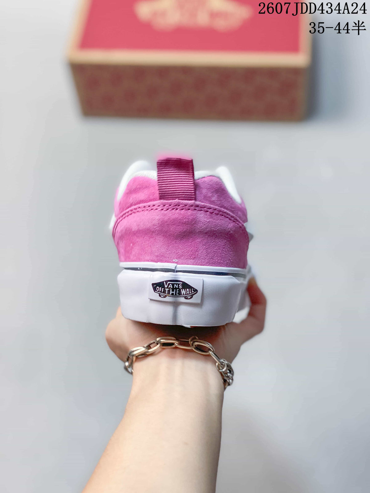 Rear view of the pink sneaker showing the padded heel and Vans heel label.