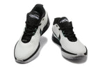 Front view of the white and black Nike sneakers with mint accents